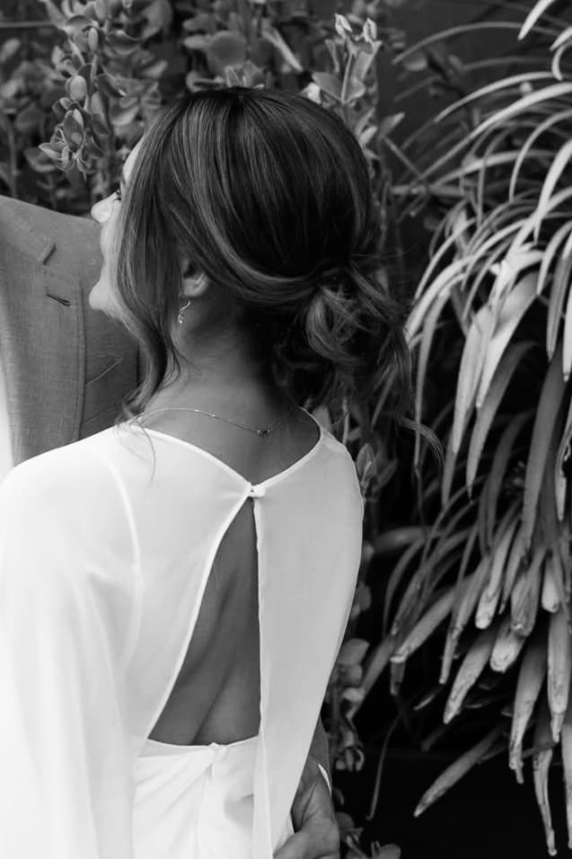 Close-up of a finished updo with soft, textured curls.